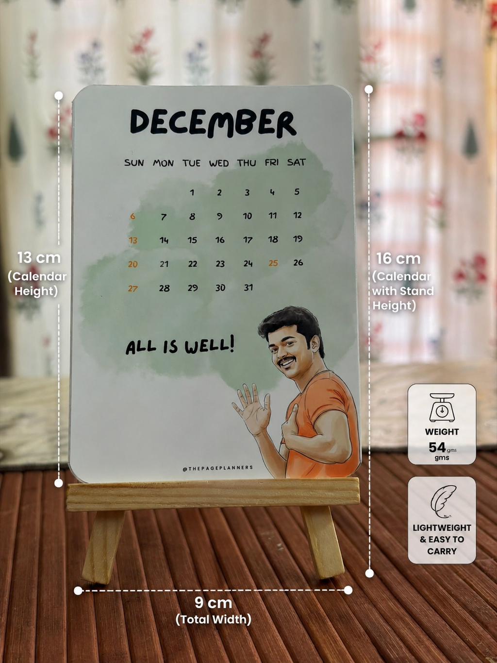 Bring your desk to life with this adorable mini desk calendar inspired by iconic movie vibes and positive energy. Designed with a premium matte finish and paired with a sturdy wooden stand, this compact calendar is perfect for work desks, study tables, bedside setups, or gifting.

✨ Product Details:
• Calendar Height: 13 cm
• Height with Stand: 16 cm
• Width: 9 cm
• Weight: 54 gms
• Lightweight & Easy to Carry
• Reusable Wooden Stand Included
• Premium Print Quality with Smooth Finish

Perfect for:
🎁 Gifts